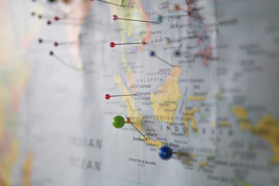 A world map marked with destination pins